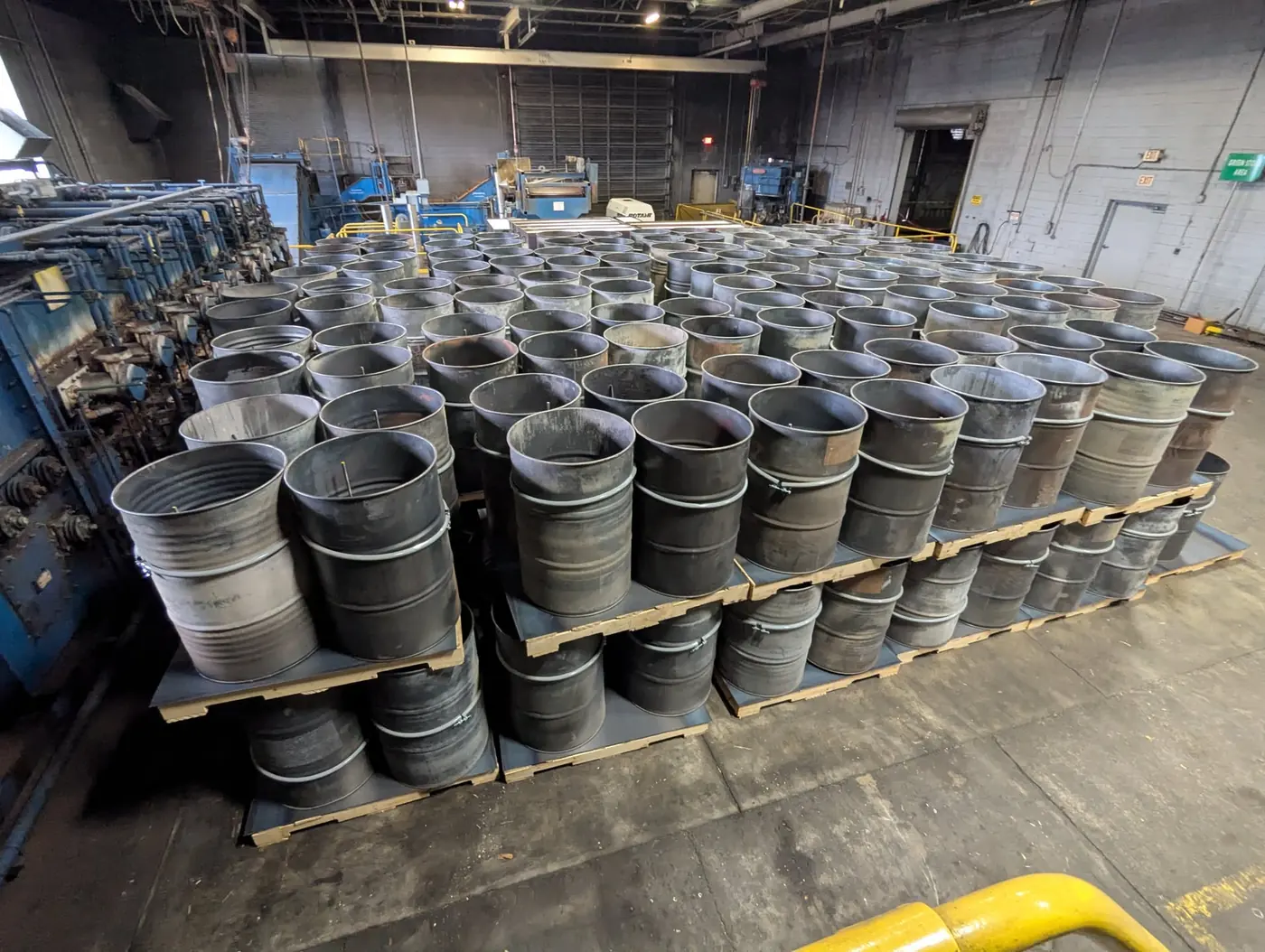 More than 250 fifty-five gallon drums staged in a plant for a large-scale molten salt pumpout